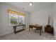 Bright home office with neutral walls, carpet, window with blinds, desk and decor at 4427 Poplin Grove Dr, Indian Trail, NC 28079