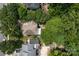 An aerial view shows the neighborhood's densely treed, well-spaced homes, showcasing a peaceful residential setting at 4439 Brandie Glen Rd, Charlotte, NC 28269
