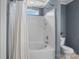 Full bath features a shower and tub combination with white tile surround at 4439 Brandie Glen Rd, Charlotte, NC 28269