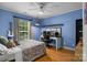 Comfortable bedroom with an office space and ceiling fan at 4439 Brandie Glen Rd, Charlotte, NC 28269