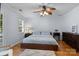 Comfortable bedroom features hardwood floors, ceiling fan and lots of natural light at 4439 Brandie Glen Rd, Charlotte, NC 28269