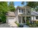 Charming two-story home with a front porch, balcony, blue shutters, a well manicured yard, and attached garage at 4439 Brandie Glen Rd, Charlotte, NC 28269