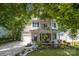 Charming two-story home featuring a welcoming front porch, upper balcony, attached garage and beautifully landscaped yard at 4439 Brandie Glen Rd, Charlotte, NC 28269