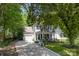 Charming two-story home with a front porch, balcony, blue shutters, a well manicured yard, and attached garage at 4439 Brandie Glen Rd, Charlotte, NC 28269