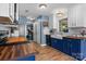 Charming kitchen boasts two-tone cabinets, wood counters, stainless appliances, and a farmhouse sink at 4439 Brandie Glen Rd, Charlotte, NC 28269