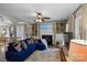 Spacious living room featuring a cozy fireplace, built-in shelving, hardwood flooring and comfortable seating at 4439 Brandie Glen Rd, Charlotte, NC 28269