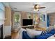 Cozy living room with a fireplace, built-in shelving, large windows, hardwood flooring and comfortable seating at 4439 Brandie Glen Rd, Charlotte, NC 28269