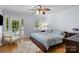 Serene main bedroom with hardwood floors, ceiling fan, and ample natural light at 4439 Brandie Glen Rd, Charlotte, NC 28269