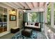 Relaxing screened porch with comfortable seating and stylish decor at 4439 Brandie Glen Rd, Charlotte, NC 28269