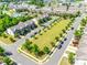 A high-angle aerial photograph of a neighborhood that features homes and community green space at 5033 Mockernut Ln, Indian Land, SC 29707