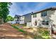 Rear exterior view of a townhome with a fenced yard at 5033 Mockernut Ln, Indian Land, SC 29707