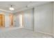 Large secondary bedroom with tray ceiling, neutral carpet and multiple walk-in closets at 5033 Mockernut Ln, Indian Land, SC 29707