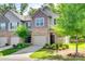 Charming townhome with attached garage, green lawn and mature landscaping at 5033 Mockernut Ln, Indian Land, SC 29707