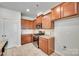 Modern kitchen with granite countertops, stainless steel appliances, and light-colored floors at 5033 Mockernut Ln, Indian Land, SC 29707