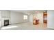 Bright open-concept living space featuring a fireplace and a view of the modern kitchen at 5033 Mockernut Ln, Indian Land, SC 29707