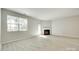 Bright living room with fireplace and ample natural light at 5033 Mockernut Ln, Indian Land, SC 29707