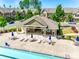 Community pool and gathering space with lounge chairs and umbrella tables at 5033 Mockernut Ln, Indian Land, SC 29707