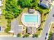 Overhead shot of community pool with lounge chairs, umbrellas, and ample parking at 5033 Mockernut Ln, Indian Land, SC 29707