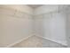 Large, empty walk-in closet with wire shelving and neutral carpet at 5033 Mockernut Ln, Indian Land, SC 29707