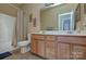 Bathroom featuring a double sink vanity with a shower and tub combination at 604 Palmerston Ln, Waxhaw, NC 28173