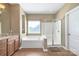 Bright bathroom featuring a soaking tub and glass-enclosed shower at 604 Palmerston Ln, Waxhaw, NC 28173
