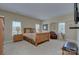 Large bedroom featuring a sitting area, many windows and carpeted floor at 604 Palmerston Ln, Waxhaw, NC 28173
