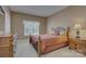 Cozy bedroom with a large window and decorative wrought iron bedframe at 604 Palmerston Ln, Waxhaw, NC 28173