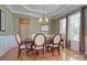 Formal dining room features hardwood floors, a decorative chandelier, and wainscoting at 604 Palmerston Ln, Waxhaw, NC 28173