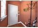 Entryway with coat rack, white door, and hardwood-style floors at 604 Palmerston Ln, Waxhaw, NC 28173