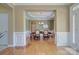 Elegant entryway with hardwood floors, white trim, and a view of the formal dining room at 604 Palmerston Ln, Waxhaw, NC 28173