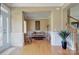 Bright entryway with hardwood floors and a view into the living room at 604 Palmerston Ln, Waxhaw, NC 28173