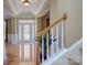 Grand entryway with hardwood floors, stairs and white trim at 604 Palmerston Ln, Waxhaw, NC 28173