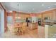 Bright kitchen with a central island, wooden cabinetry, and stainless steel appliances, perfect for cooking and dining at 604 Palmerston Ln, Waxhaw, NC 28173