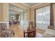 Open concept living room with views to the entryway and dining room. Large window, too at 604 Palmerston Ln, Waxhaw, NC 28173