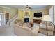 Cozy living room with a fireplace, neutral paint, and plush seating, perfect for relaxing and entertaining guests at 604 Palmerston Ln, Waxhaw, NC 28173