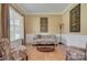 Cozy living room with hardwood floors and a decorative art piece on the wall at 604 Palmerston Ln, Waxhaw, NC 28173