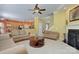 Inviting living room with fireplace, neutral couches, and open access to the kitchen at 604 Palmerston Ln, Waxhaw, NC 28173