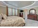 Spacious main bedroom with a tray ceiling, large windows and an ornate dresser at 604 Palmerston Ln, Waxhaw, NC 28173