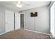 Carpeted bedroom with a ceiling fan, and mounted television at 7442 Sparkleberry Dr, Indian Trail, NC 28079