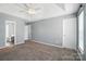 Spacious bedroom with neutral walls, carpeted floor, ceiling fan, and bathroom access at 7442 Sparkleberry Dr, Indian Trail, NC 28079