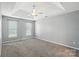Spacious bedroom with two sunny windows and a neutral color scheme, providing a serene atmosphere at 7442 Sparkleberry Dr, Indian Trail, NC 28079