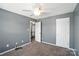 Spacious carpeted bedroom with a ceiling fan and two closets at 7442 Sparkleberry Dr, Indian Trail, NC 28079