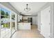 Kitchen and dinette area offering ample space, abundant natural light, and access to a deck at 7442 Sparkleberry Dr, Indian Trail, NC 28079
