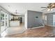 Open-concept living area with hardwood floors, seamlessly connecting to the adjacent kitchen at 7442 Sparkleberry Dr, Indian Trail, NC 28079