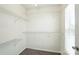 Walk-in closet with adjustable shelving and natural light at 7442 Sparkleberry Dr, Indian Trail, NC 28079