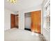 Bright bedroom features neutral carpeting, closet, and large windows with lots of natural light at 7501 Glencannon Dr, Charlotte, NC 28227