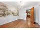 Dining room with hardwood floors and decorative mural at 7501 Glencannon Dr, Charlotte, NC 28227
