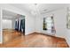 Open dining room with hardwood floors, chandelier, and ample natural light at 7501 Glencannon Dr, Charlotte, NC 28227