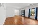 Bright living room featuring hardwood floors, large windows, and neutral walls at 7501 Glencannon Dr, Charlotte, NC 28227