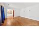 Spacious living room with hardwood floors, crown molding, and natural light at 7501 Glencannon Dr, Charlotte, NC 28227